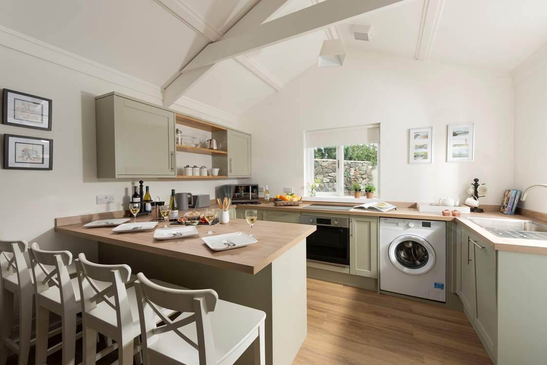 The luxury kitchen reflects the style of this delightful cottage.