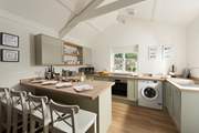The luxury kitchen reflects the style of this delightful cottage.