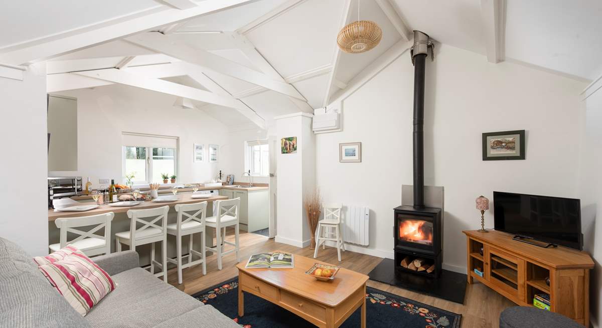 This charming cottage has an open plan living area, complete with a cosy wood-burner for those chillier evenings.