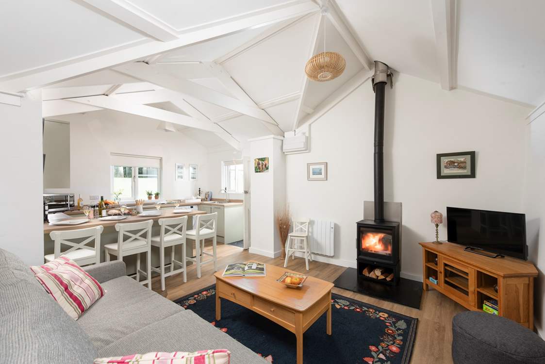 This charming cottage has an open plan living area, complete with a cosy wood-burner for those chillier evenings.