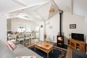 This charming cottage has an open plan living area, complete with a cosy wood-burner for those chillier evenings.