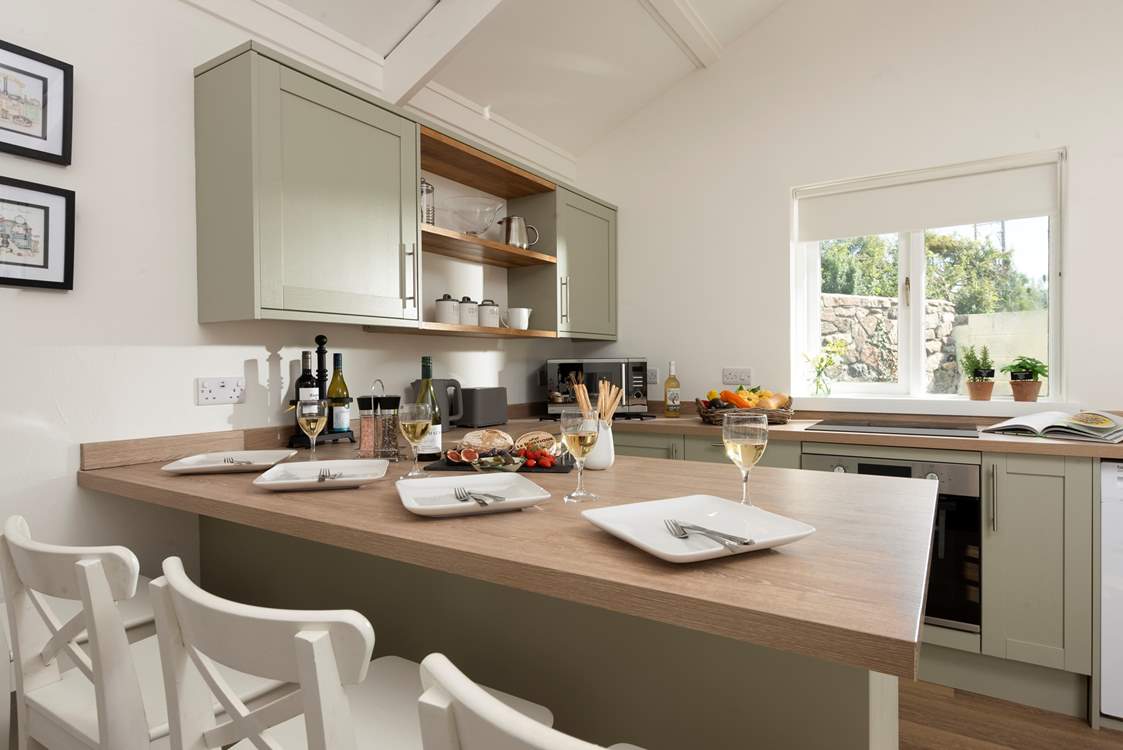 Pull up a seat and pour a glass of wine in the modern open plan living area.