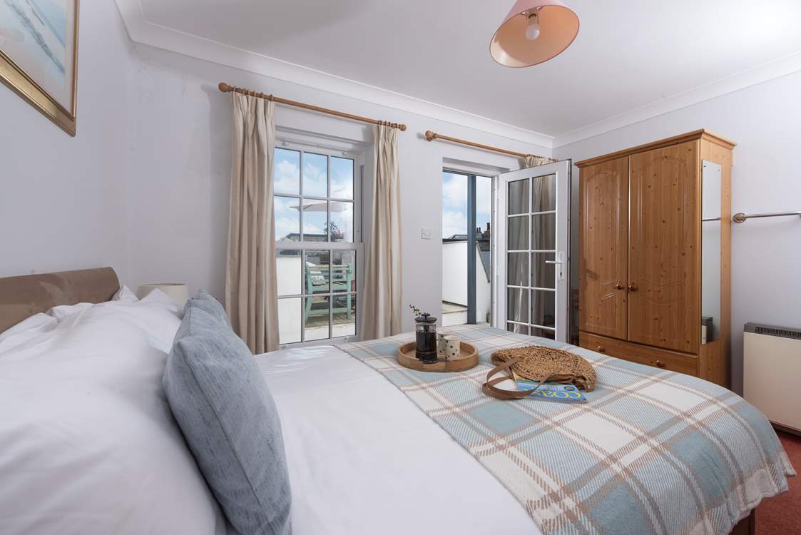 Open the patio doors and take in the sea air.