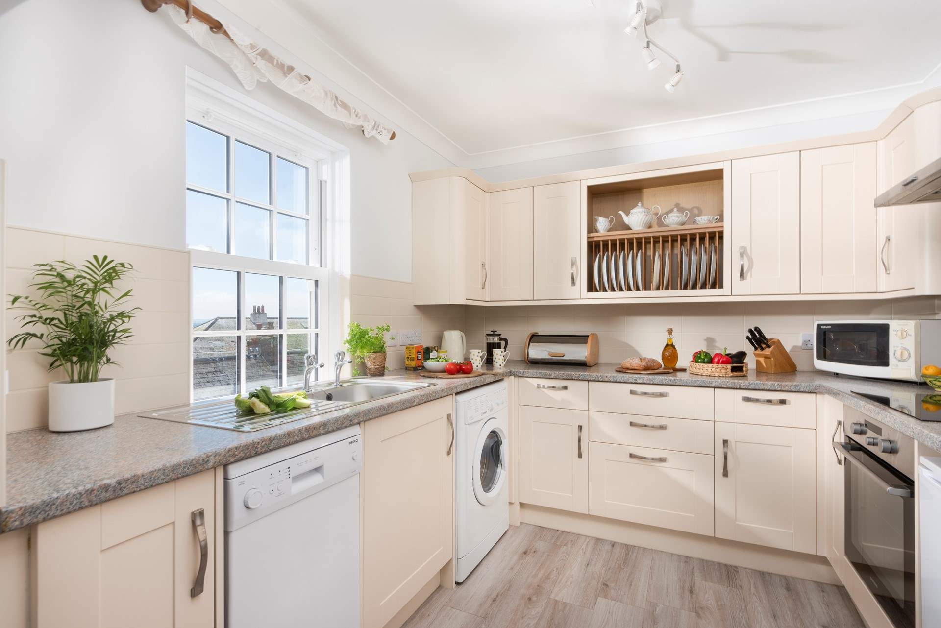 The kitchen is fully equipped for home cooking.
