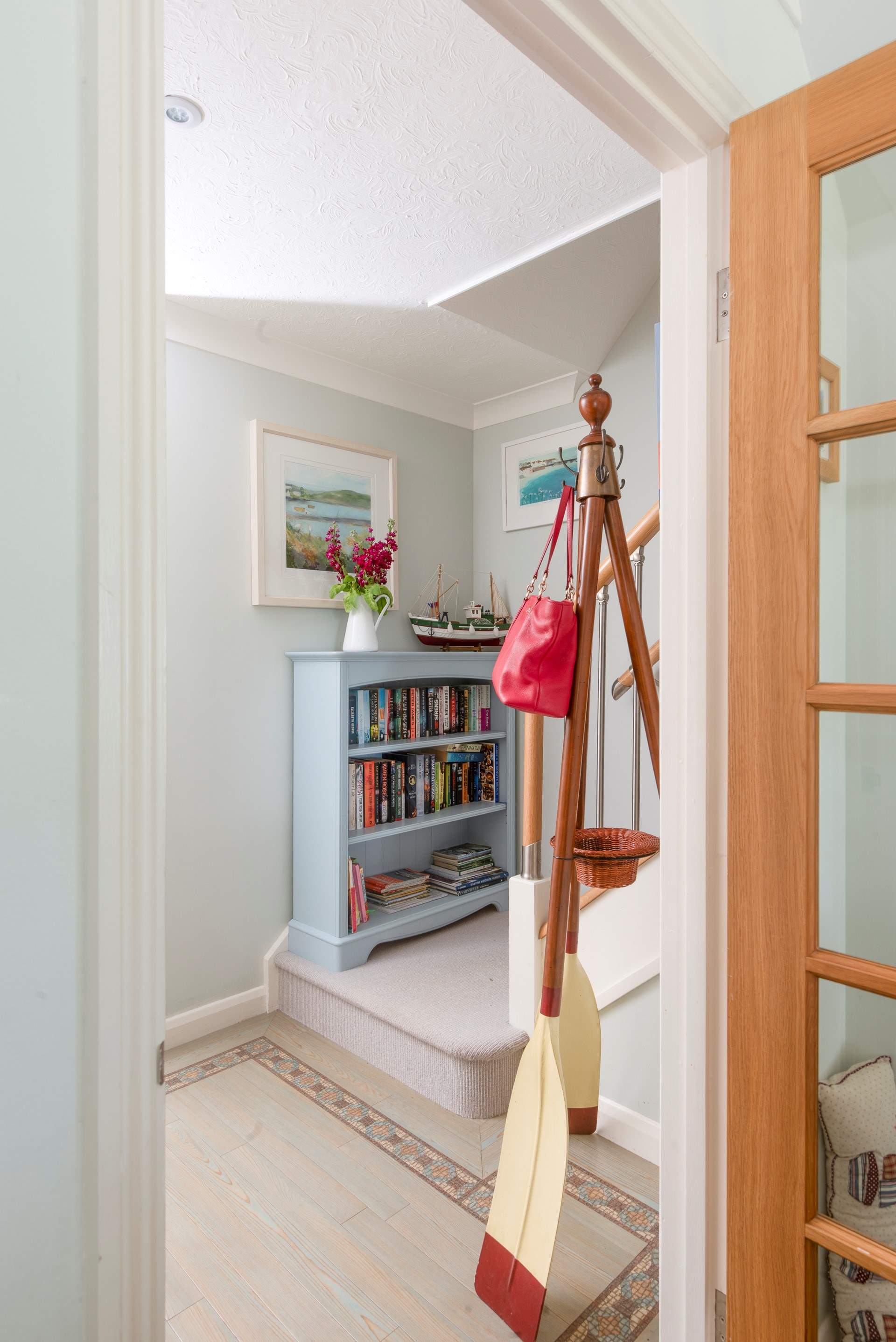 The stairs lead to the three bedrooms and family bathroom.