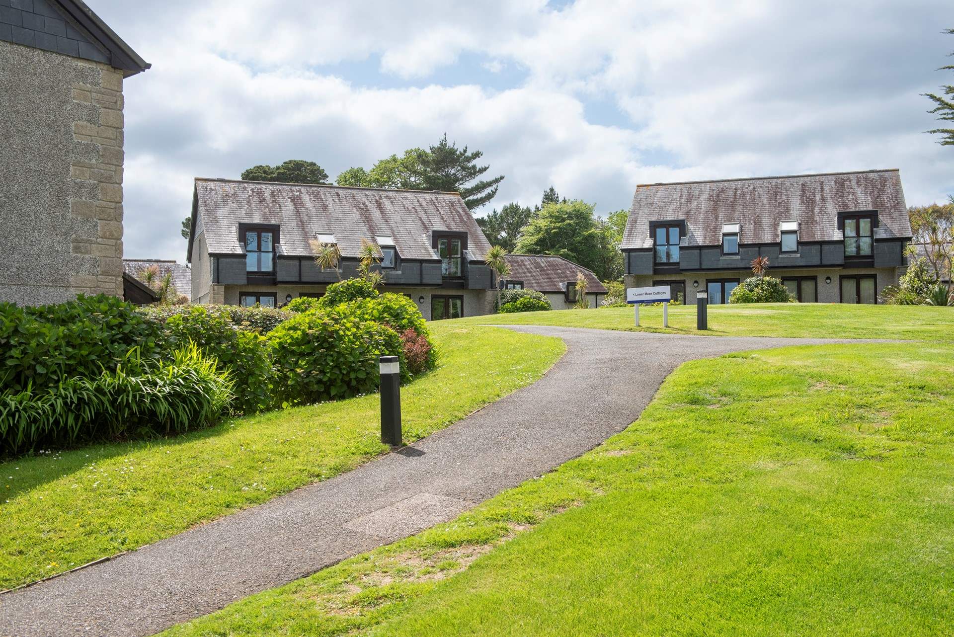 Follow the path to the left from the car park to find 65 Lower Maen Cottage. 