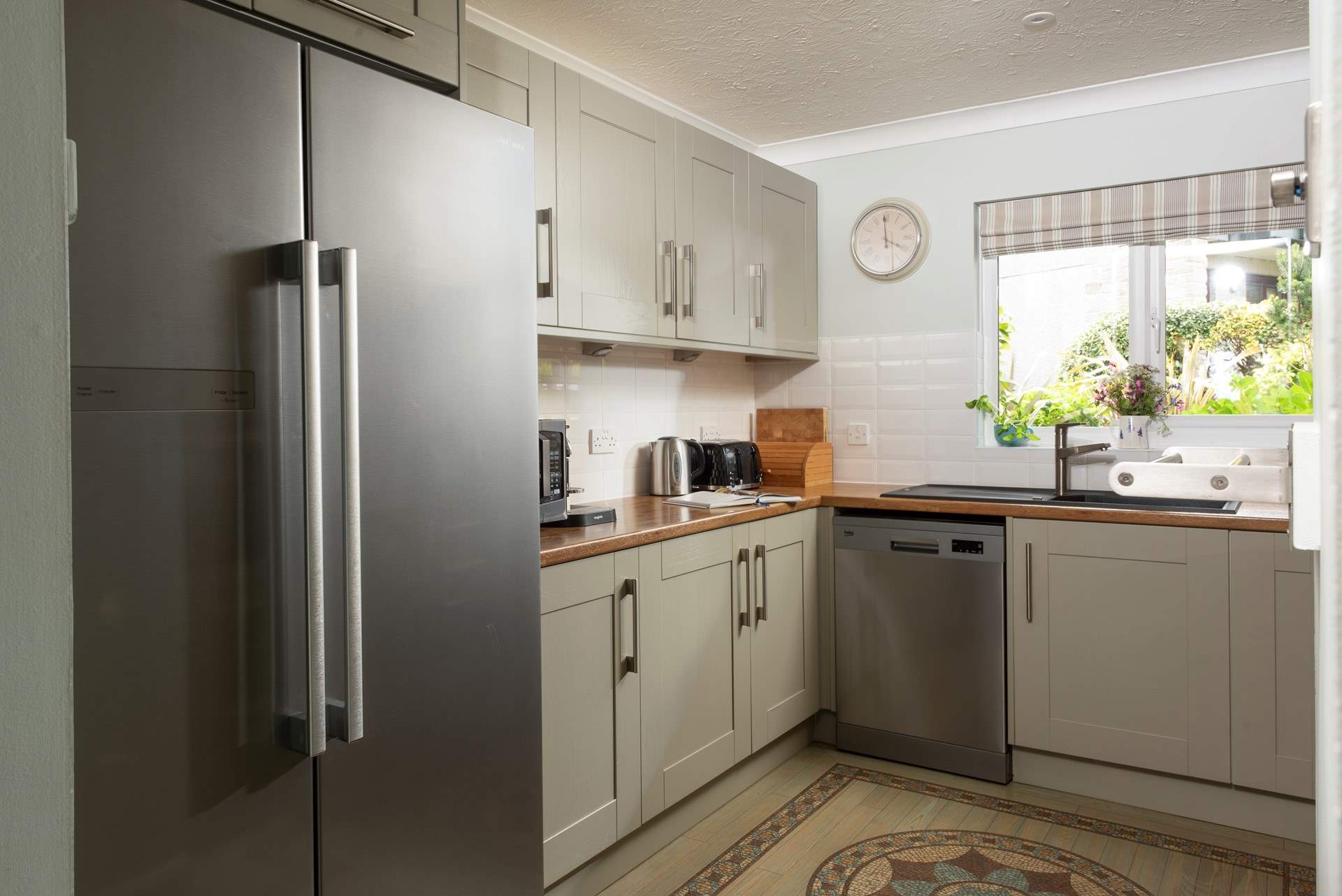 The kitchen has a large American-style fridge/freezer, perfect for a family of six on holiday. 