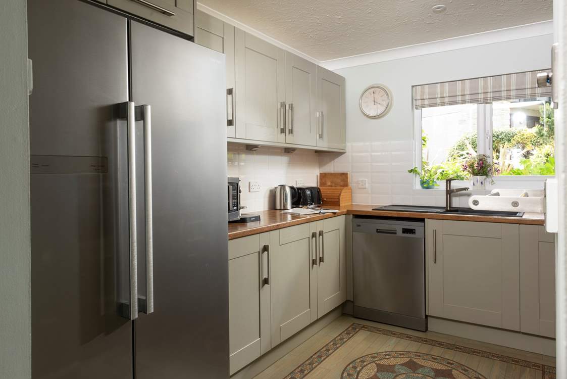 The kitchen has a large American-style fridge/freezer, perfect for a family of six on holiday.