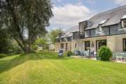 65 Lower Maen Cottage is the middle property with the lovely blue furniture.