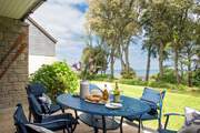Through the double doors to your patio - why go anywhere else with a view like that.