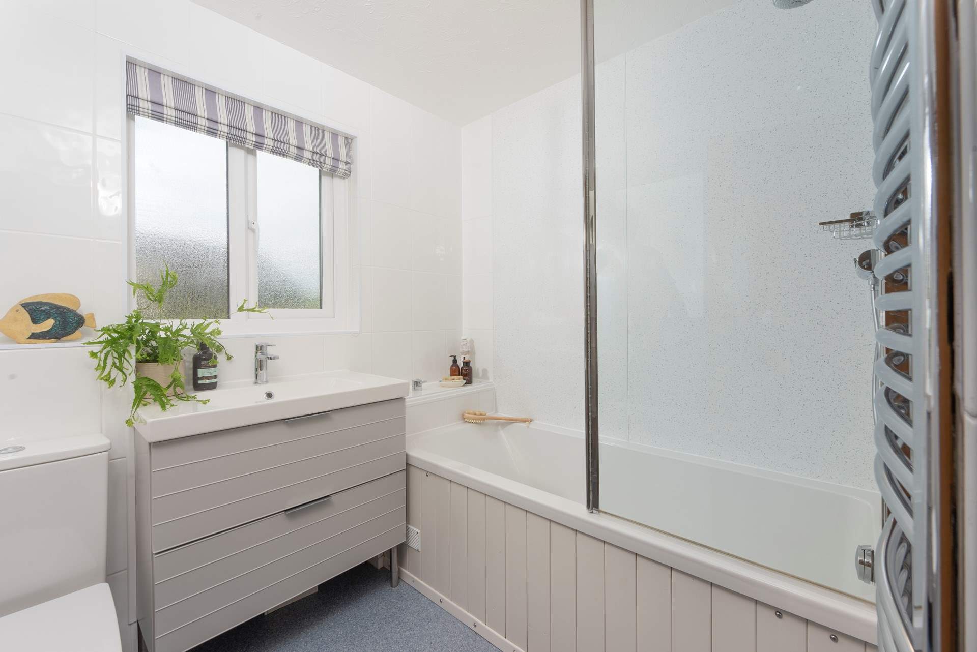 The light and airy family bathroom. 