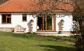 Sliding doors open onto the sun-trap patio and garden. - Thumbnail Image