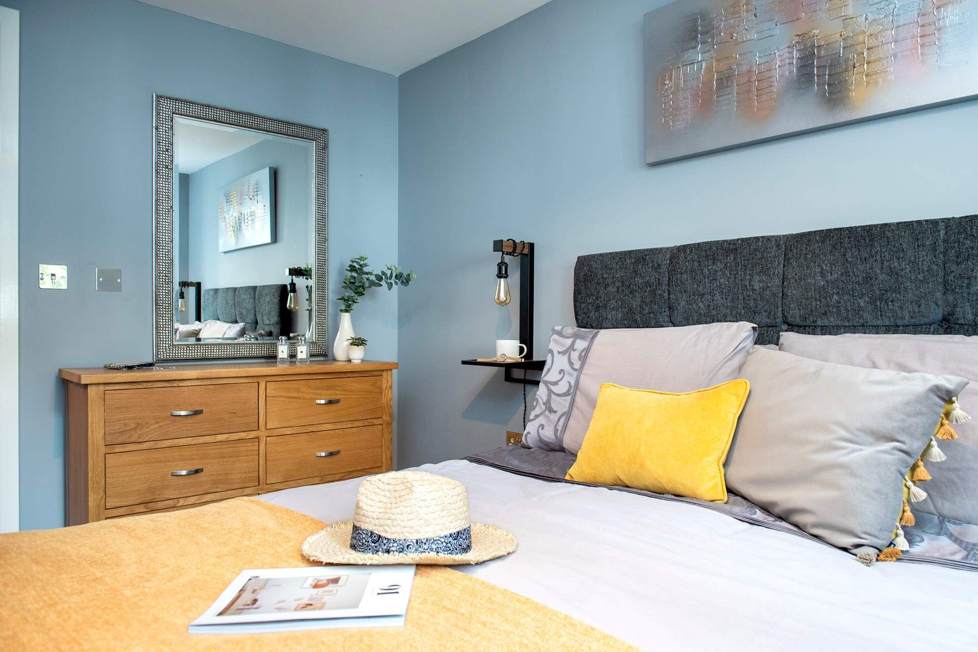 A king-size bed awaits in the apartment bedroom.