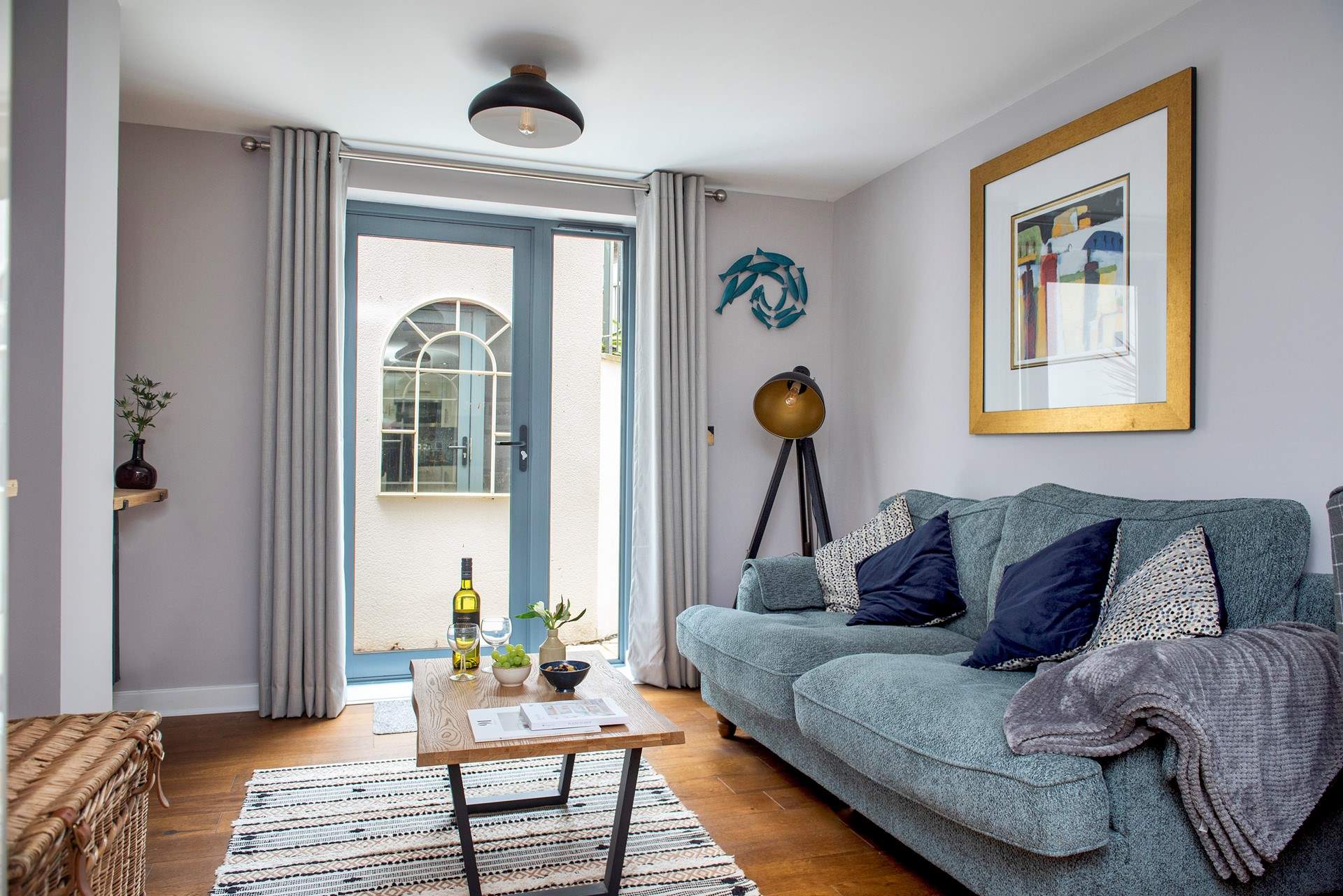 The door leads out to the sheltered terraced areas at the back of the building.