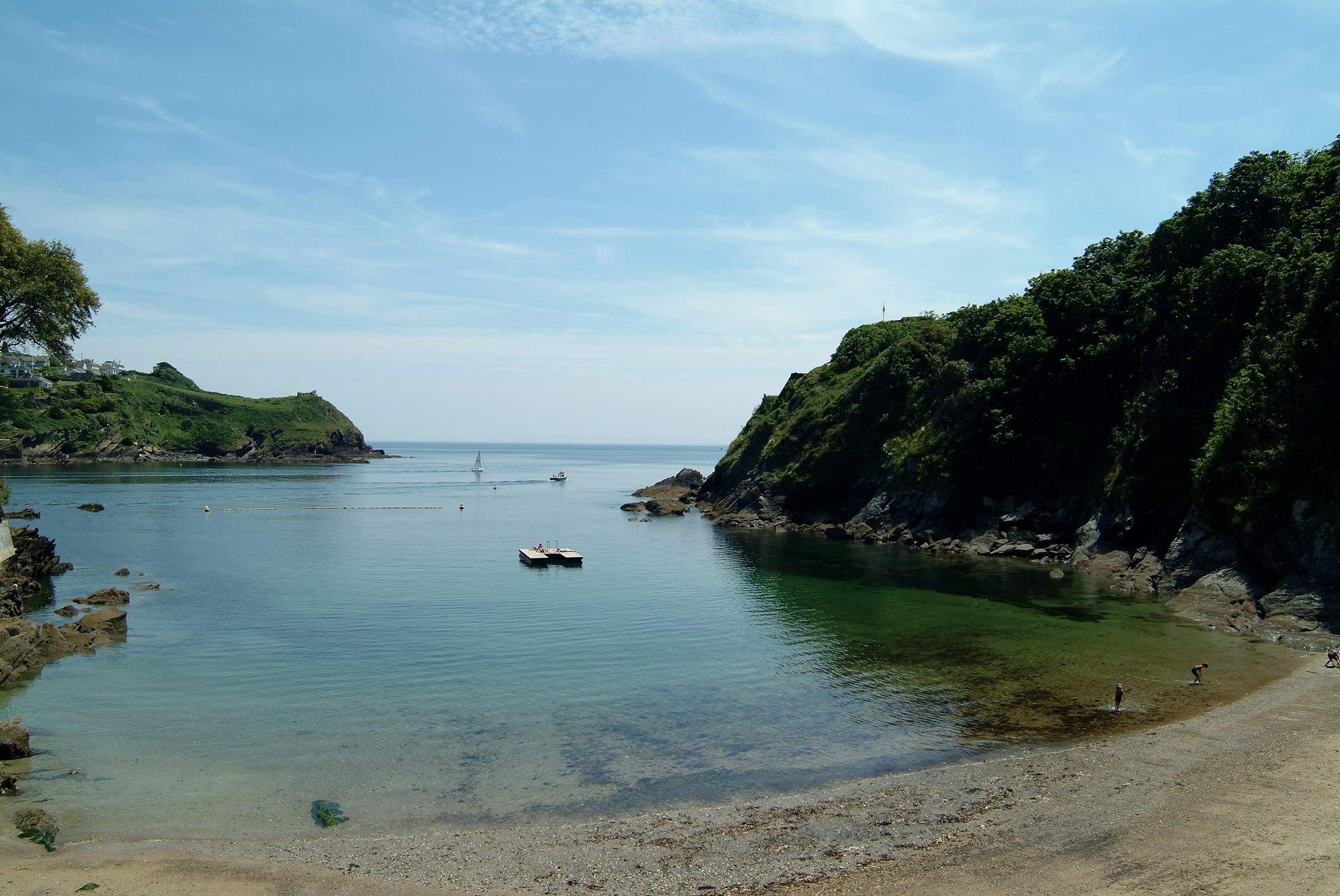 The charming, sandy beach at Readymoney Cove, sheltered by cliffs close to the mouth of the River Fowey estuary and bounded, on one side, by the medieval part of the town of Fowey and, on the other side, by St Catherine’s Castle. 