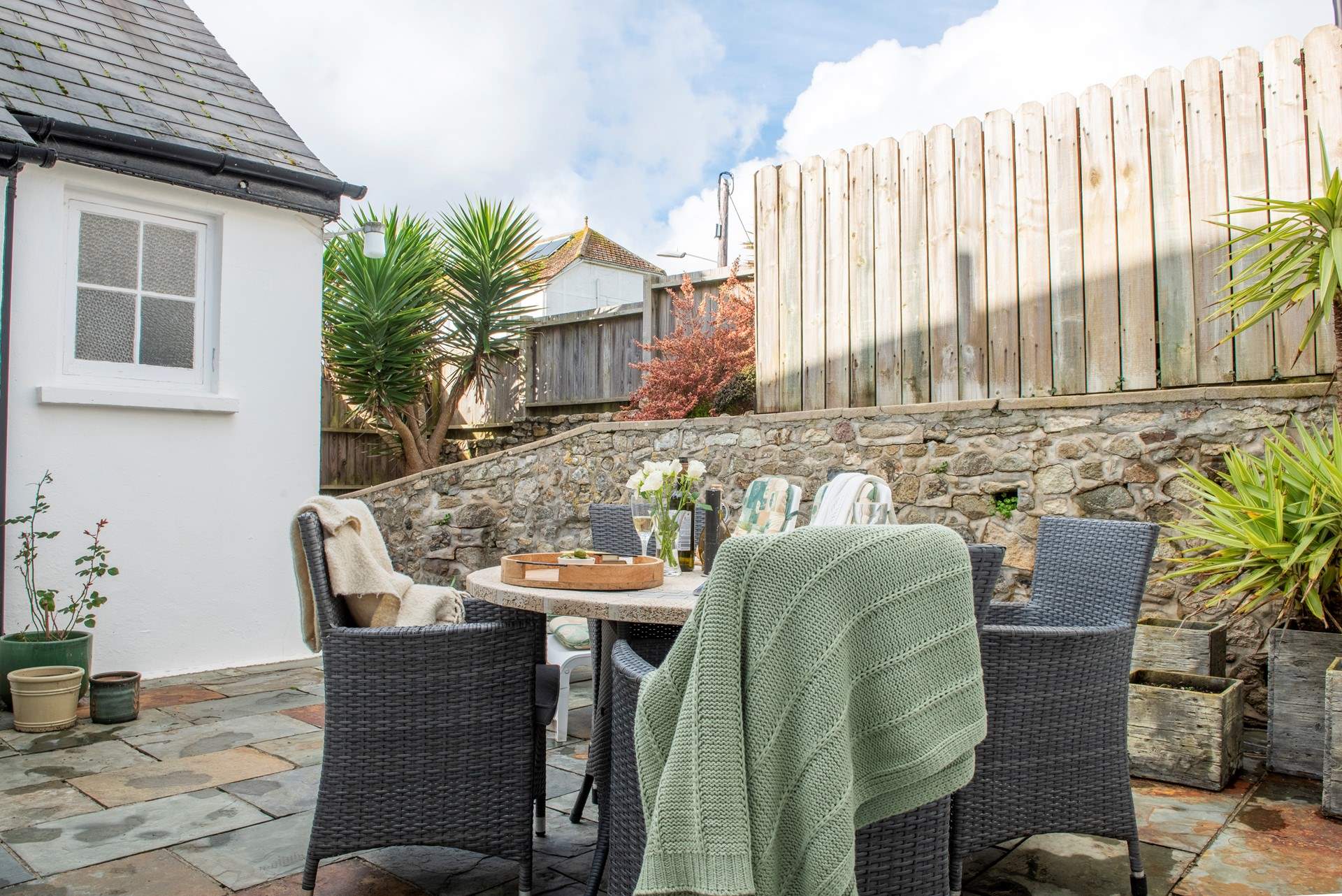 Trebah has access to a shared enclosed courtyard, this sweet bistro table and chairs is perfect for relaxing at the start and end of the day. 