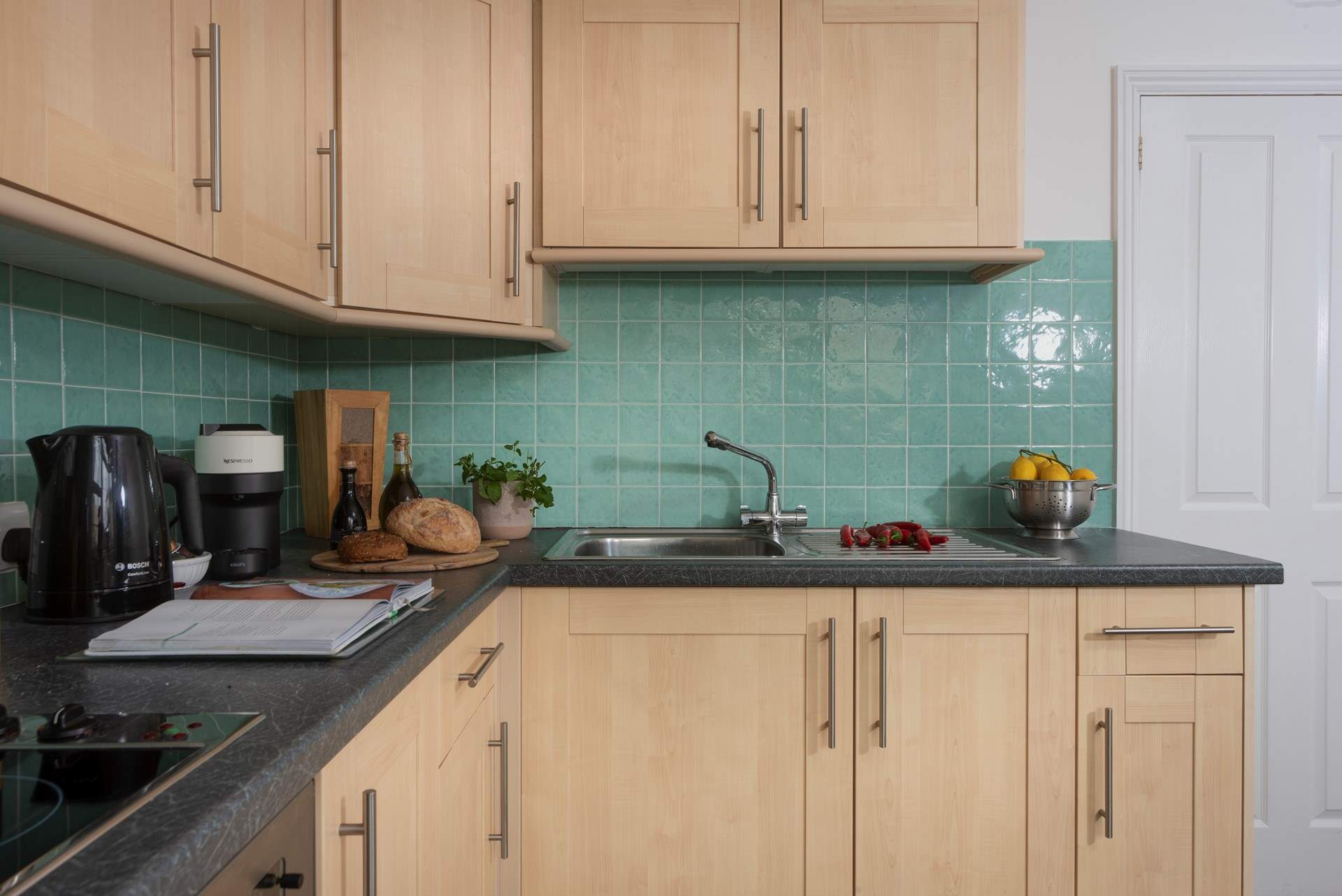 The kitchen is spacious and well-equipped. 