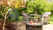 Enjoy some al fresco dining on the fire pit which doubles up as a barbecue.