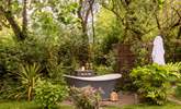 Lie back in your secluded outdoor bathtub and listen to the birdsong around you. - Thumbnail Image