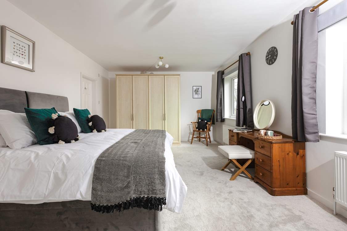 Bedroom one has an en suite shower-room and views over the surrounding countryside. This room can also be made up as a twin.