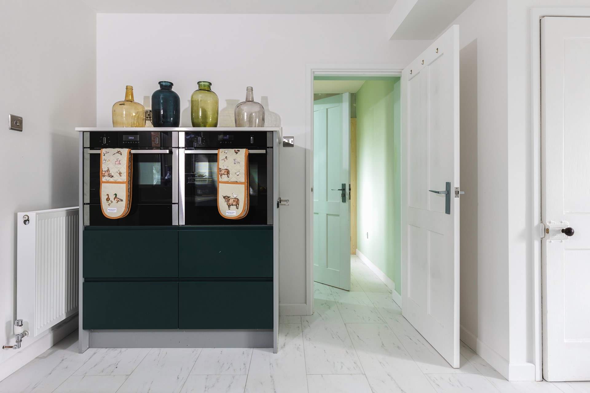 From the kitchen is a useful utility-room and WC.