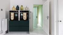 From the kitchen is a useful utility-room and WC.