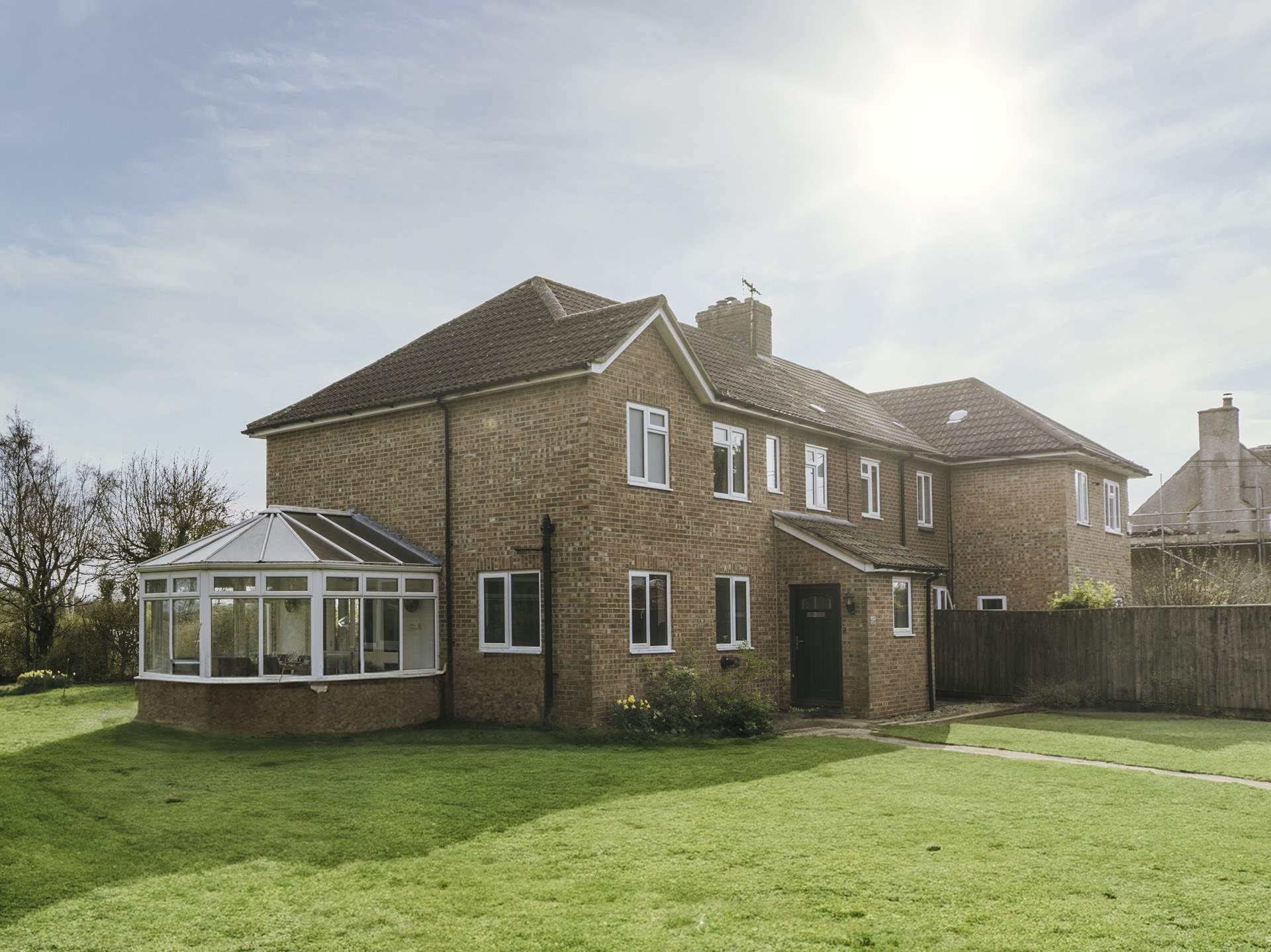 The garden wraps round the cottage.