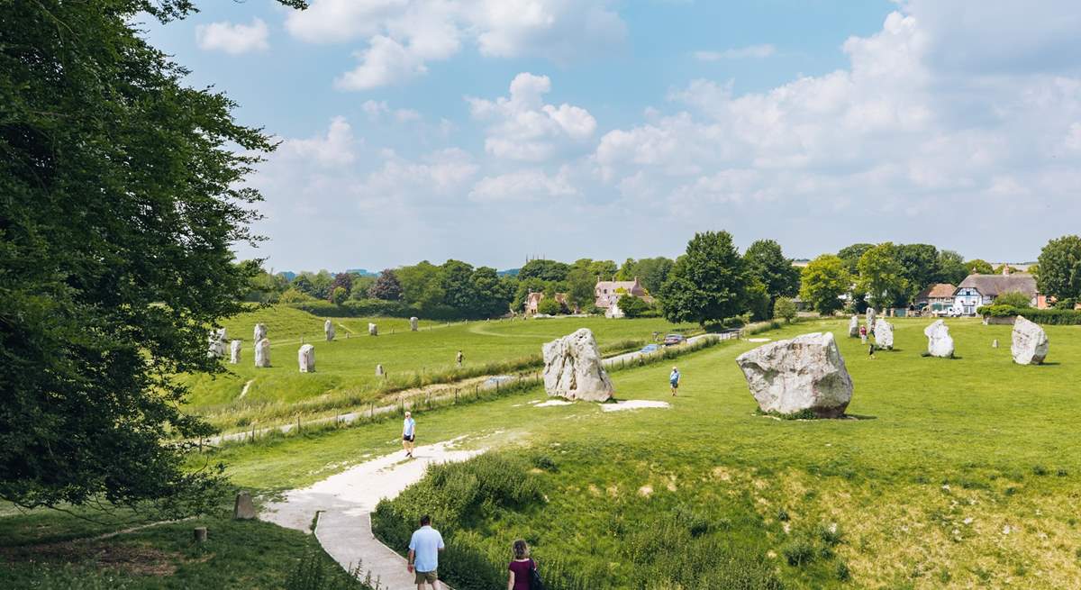 Visit Avebury and see the Neolithic henge monument containing three stone circles.