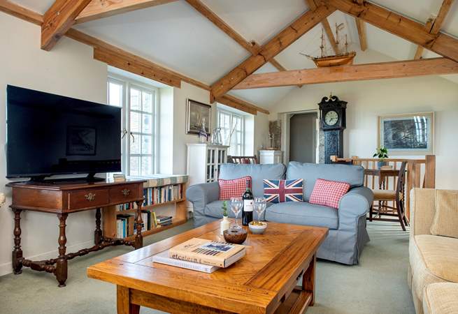 The comfortable sitting-room invites you to snuggle up and relax at the end of the day.