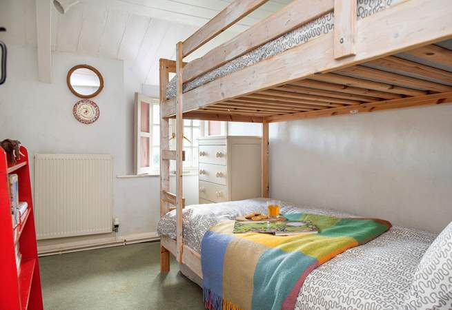 The little bunk-bedded room will delight your younger guests.