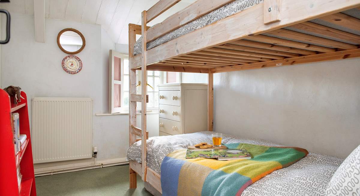 The little bunk-bedded room will delight your younger guests.