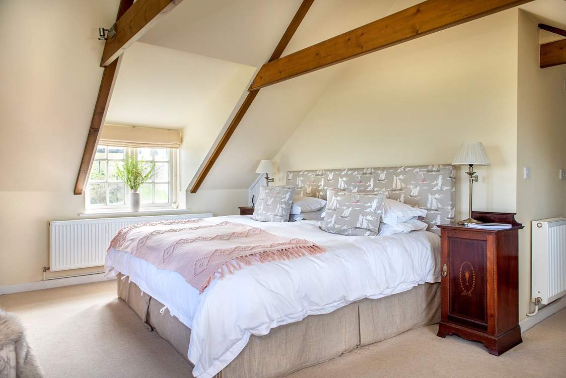 A super size, Emperor bed awaits in Bedroom One.