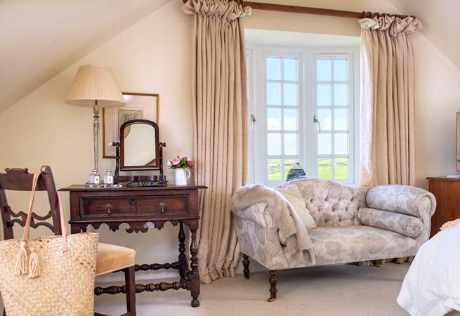 This large spacious triple aspect room,  makes the most the setting and those sublime views.