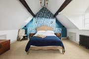 The beautiful loft space has been transformed into a stunning third bedroom.