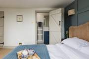 The main bedroom enjoys an en suite shower-room.