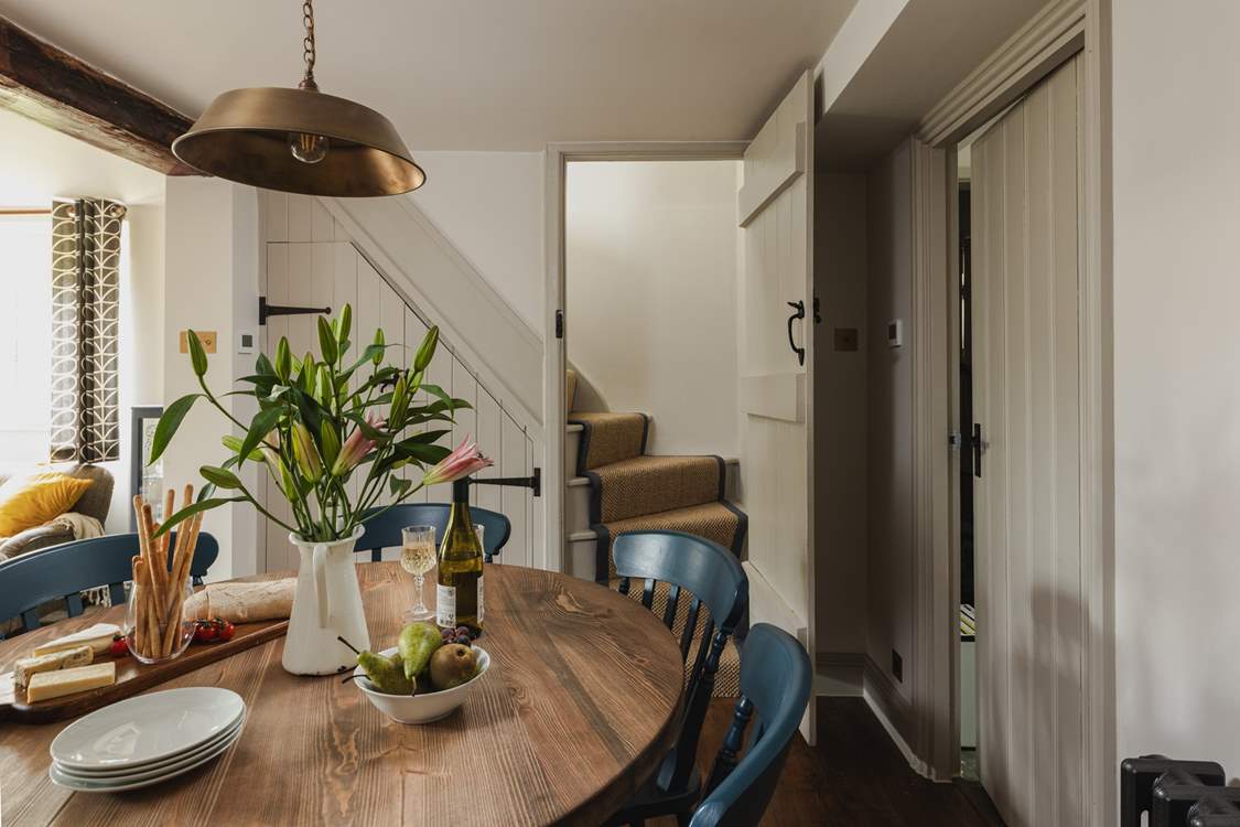 The staircase to the first floor is accessed via the dining-area.