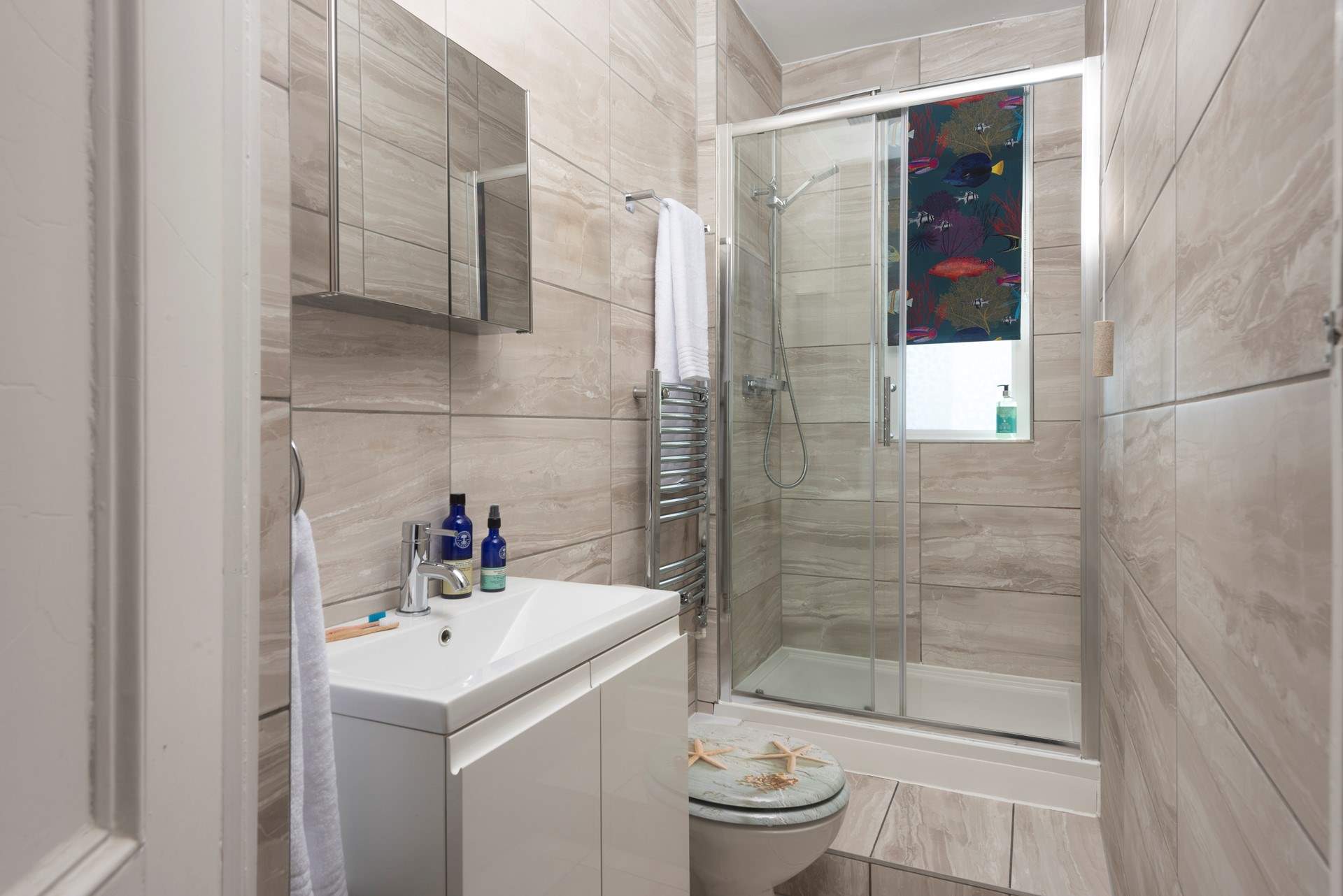 A second modern shower-room with step up into the shower.