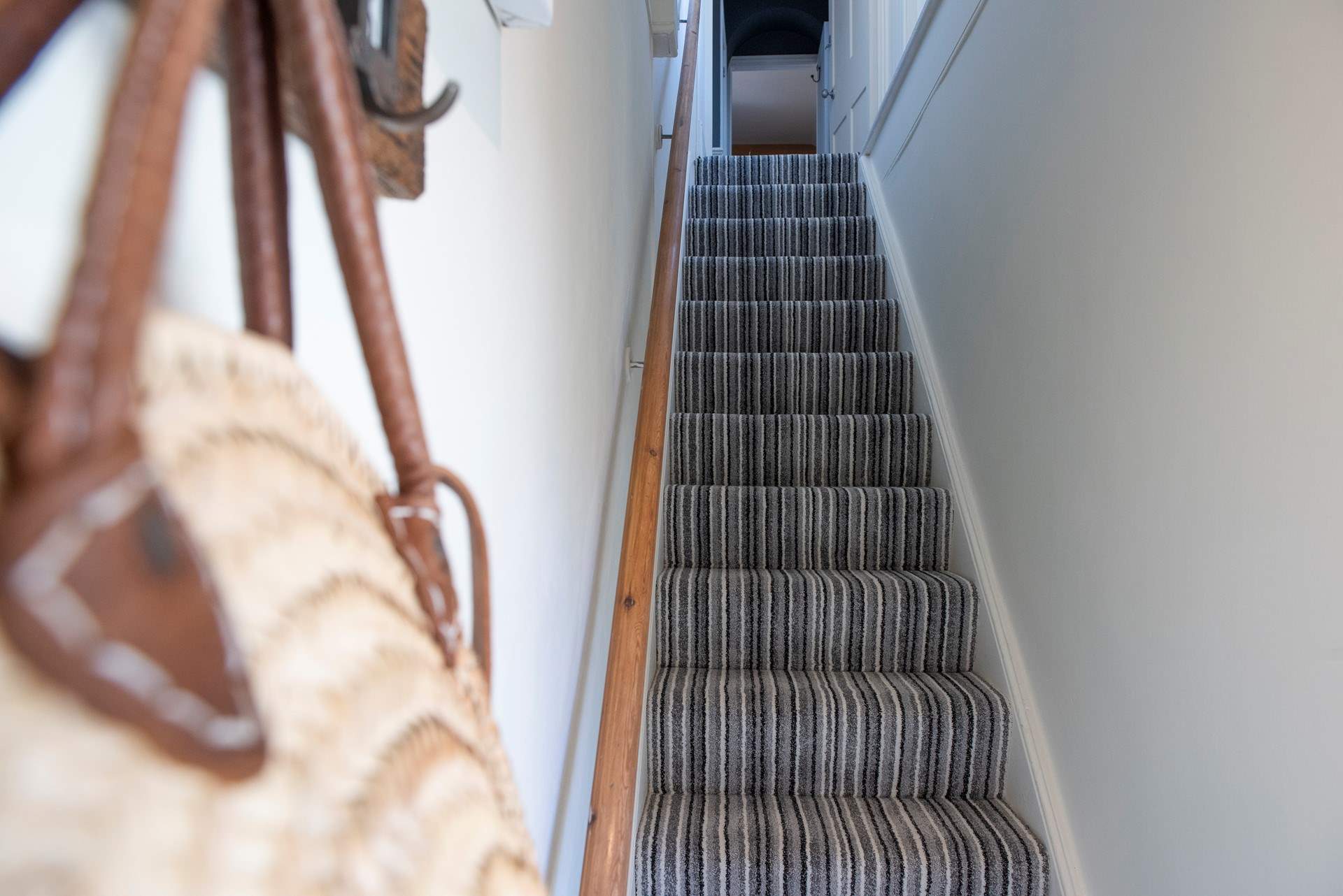 The entrance staircase with original handrail leading to this stunning first floor apartment.
