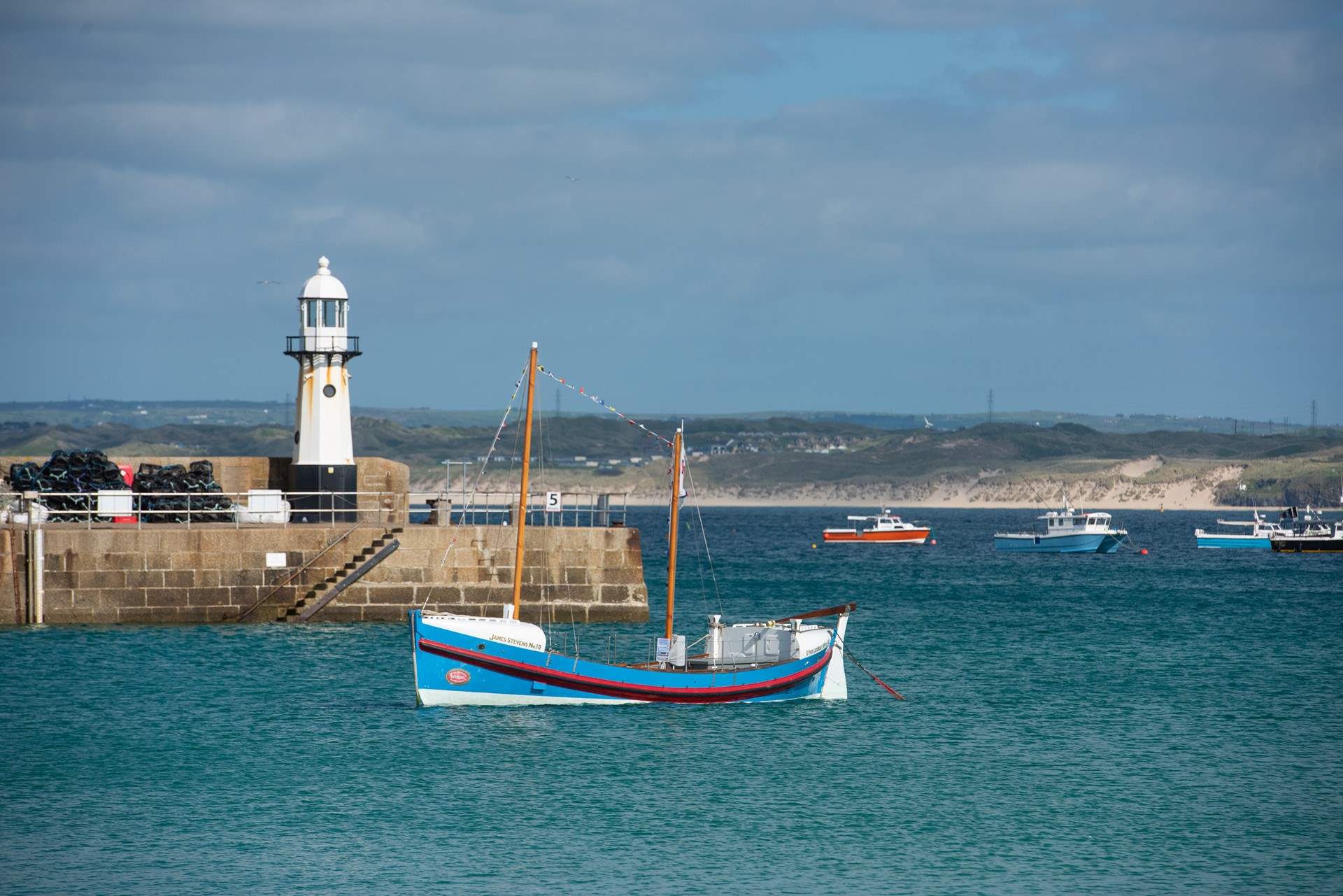 Take a stroll along the seafront in St Ives. There is always a fisherman's tale to be heard.