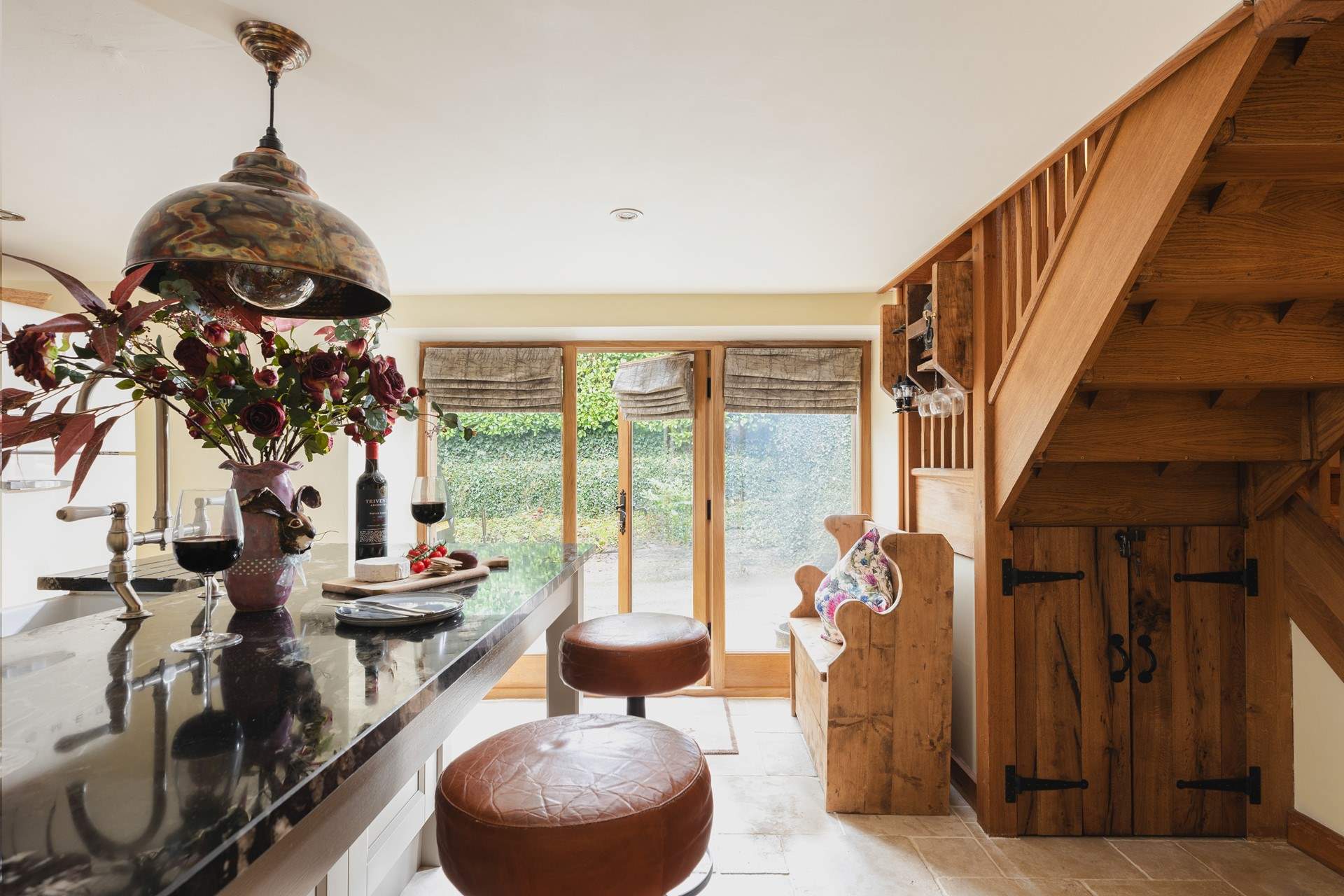 The light and airy kitchen has been beautifully renovated.