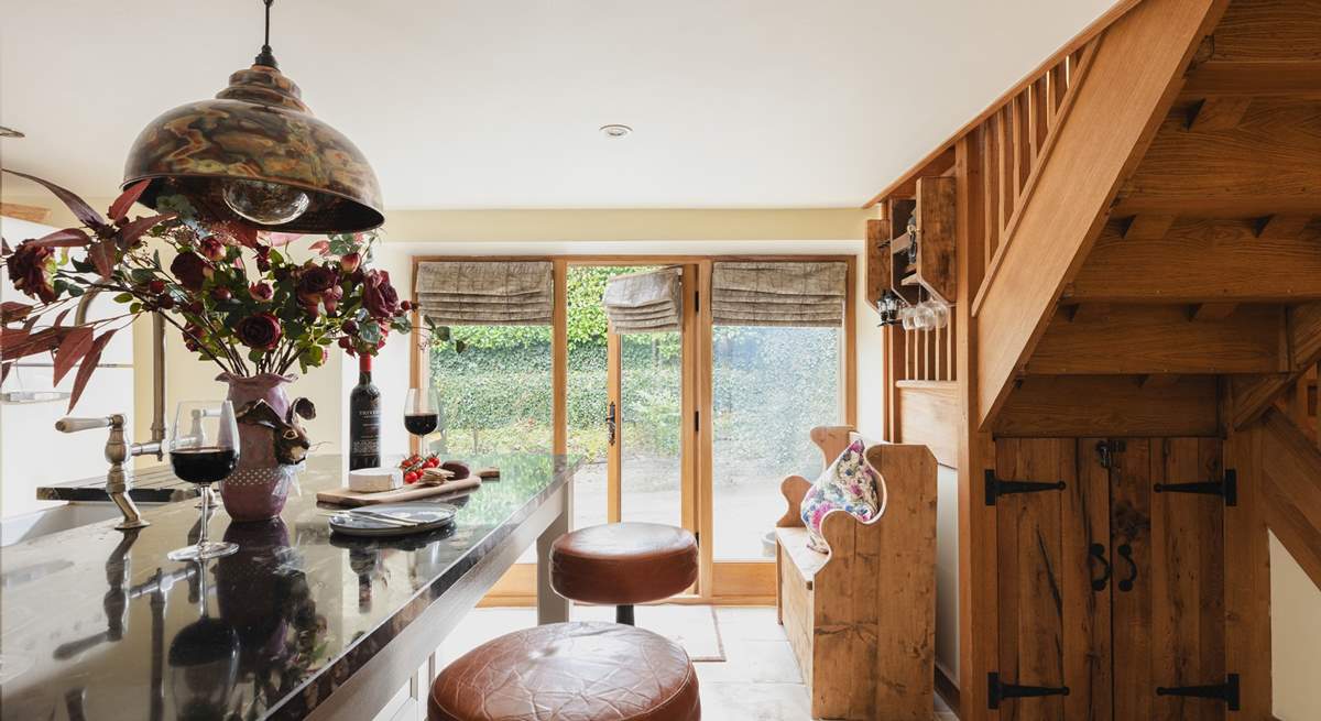 The light and airy kitchen has been beautifully renovated.