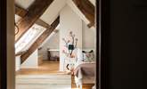 Bedroom four has a single bed and sloping ceilings and original beams - Thumbnail Image