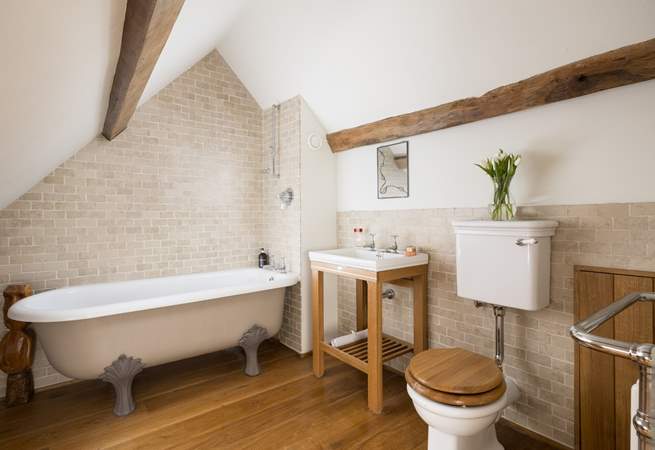 Stylish en suite bathroom to bedroom four, please note the ceiling slopes.