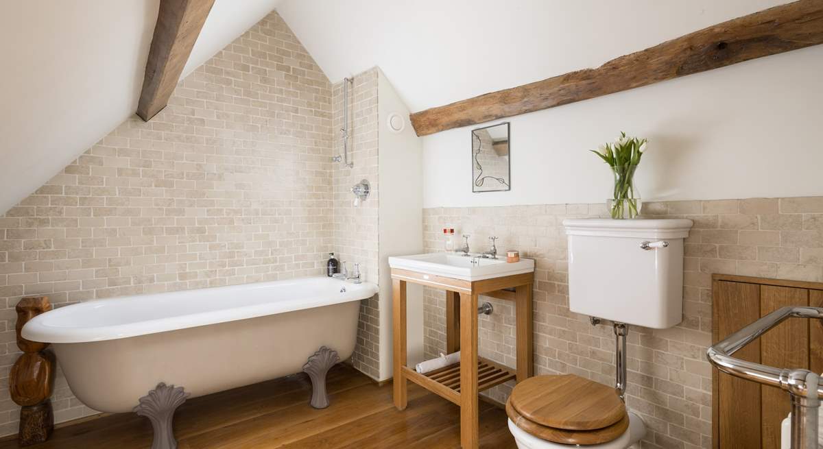 Stylish en suite bathroom to bedroom four, please note the ceiling slopes.