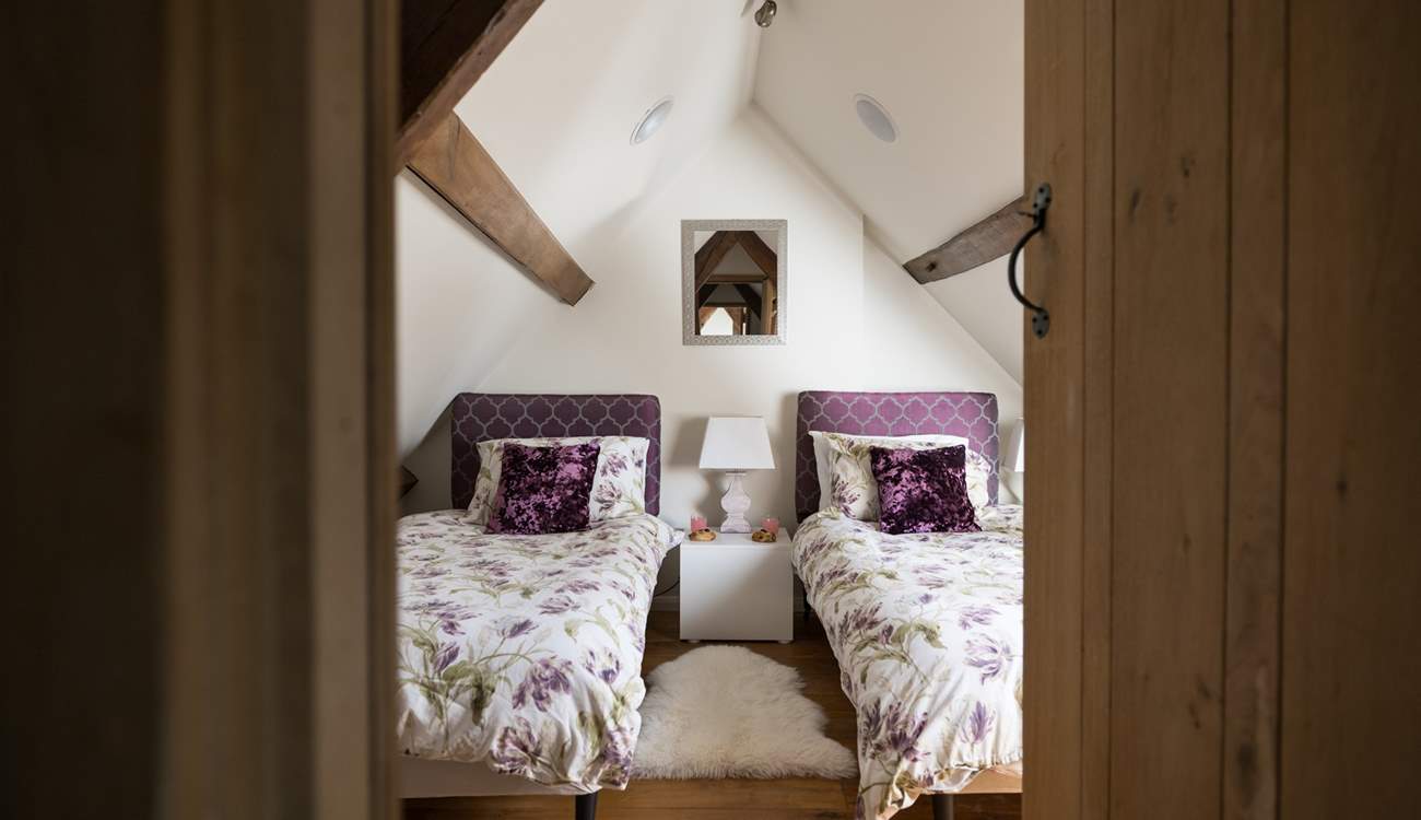 The pretty twin room on the second floor, with restricted head height.