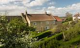 A picturesque farmhouse in a beautiful setting. - Thumbnail Image