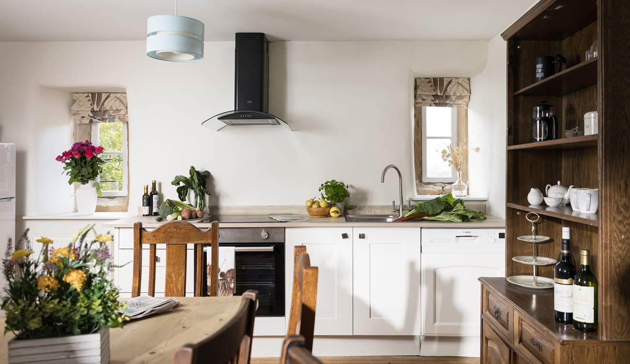 The original floor and fireplace grace the stylish kitchen.