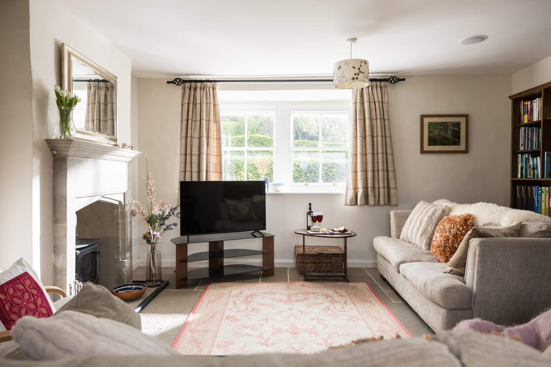 The sitting-room is light, airy and looks over the garden and countryside views.