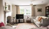 The sitting-room is light, airy and looks over the garden and countryside views. - Thumbnail Image