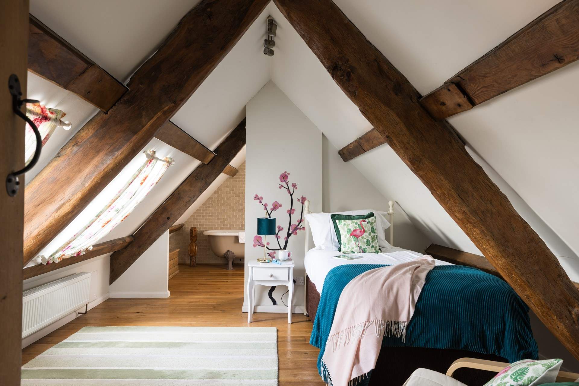 Pretty second floor single bedroom with en suite. Please note the sloping ceiling. 